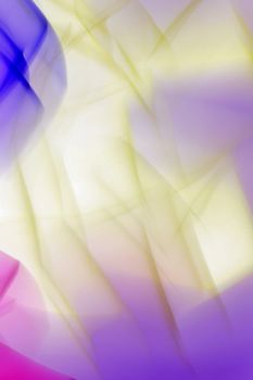 Vibrant abstract background with colorful light streaks creating a dynamic flow.