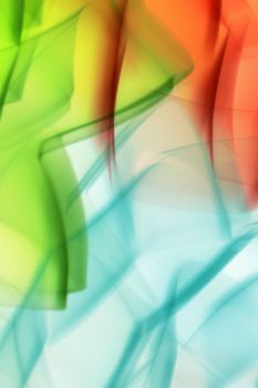 Vibrant abstract art with green, blue, and red light patterns, capturing vivid energy in Guaratuba.
