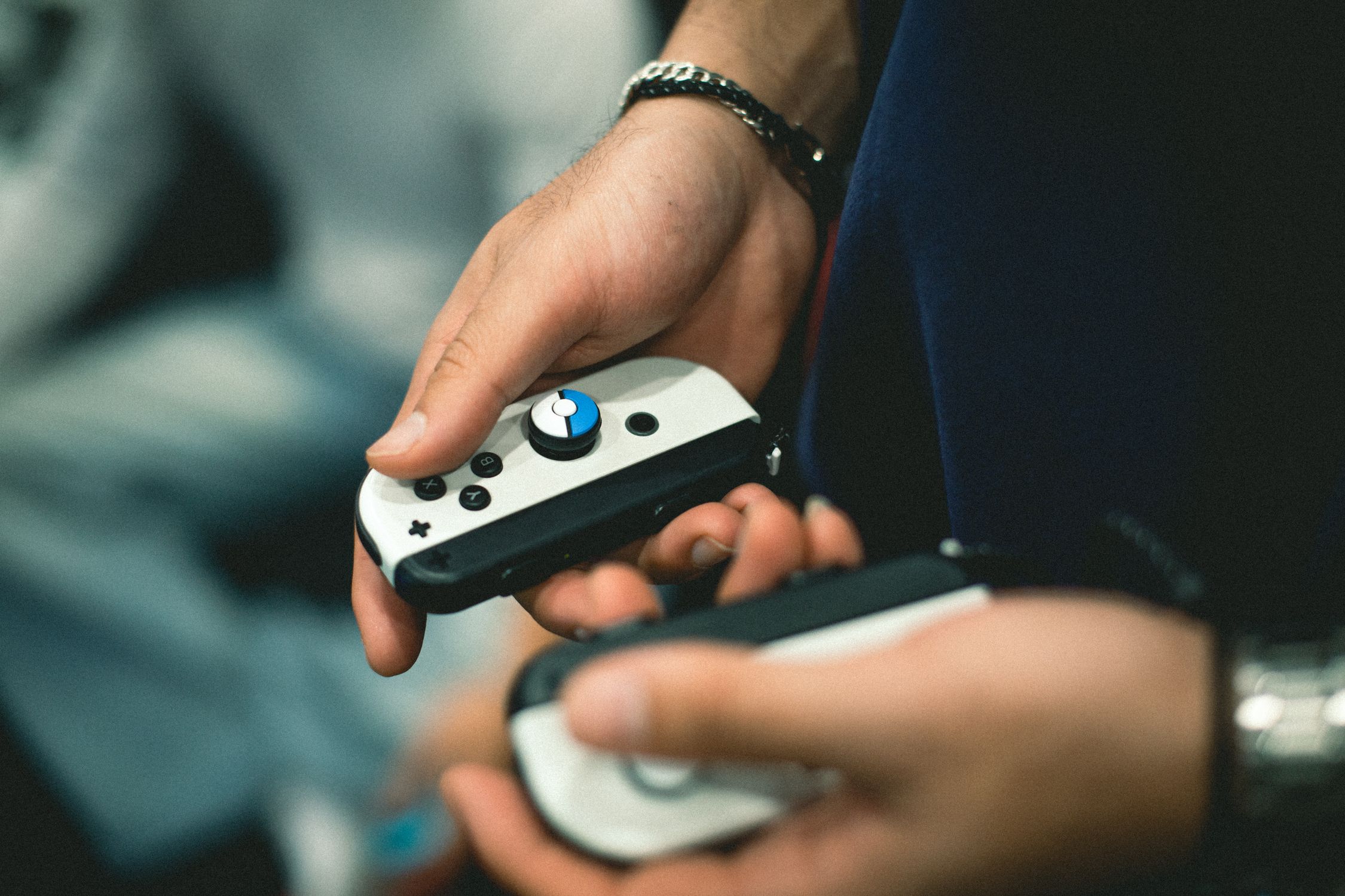Close-up of Hands Holding Gaming Controllers · Free Stock Photo
