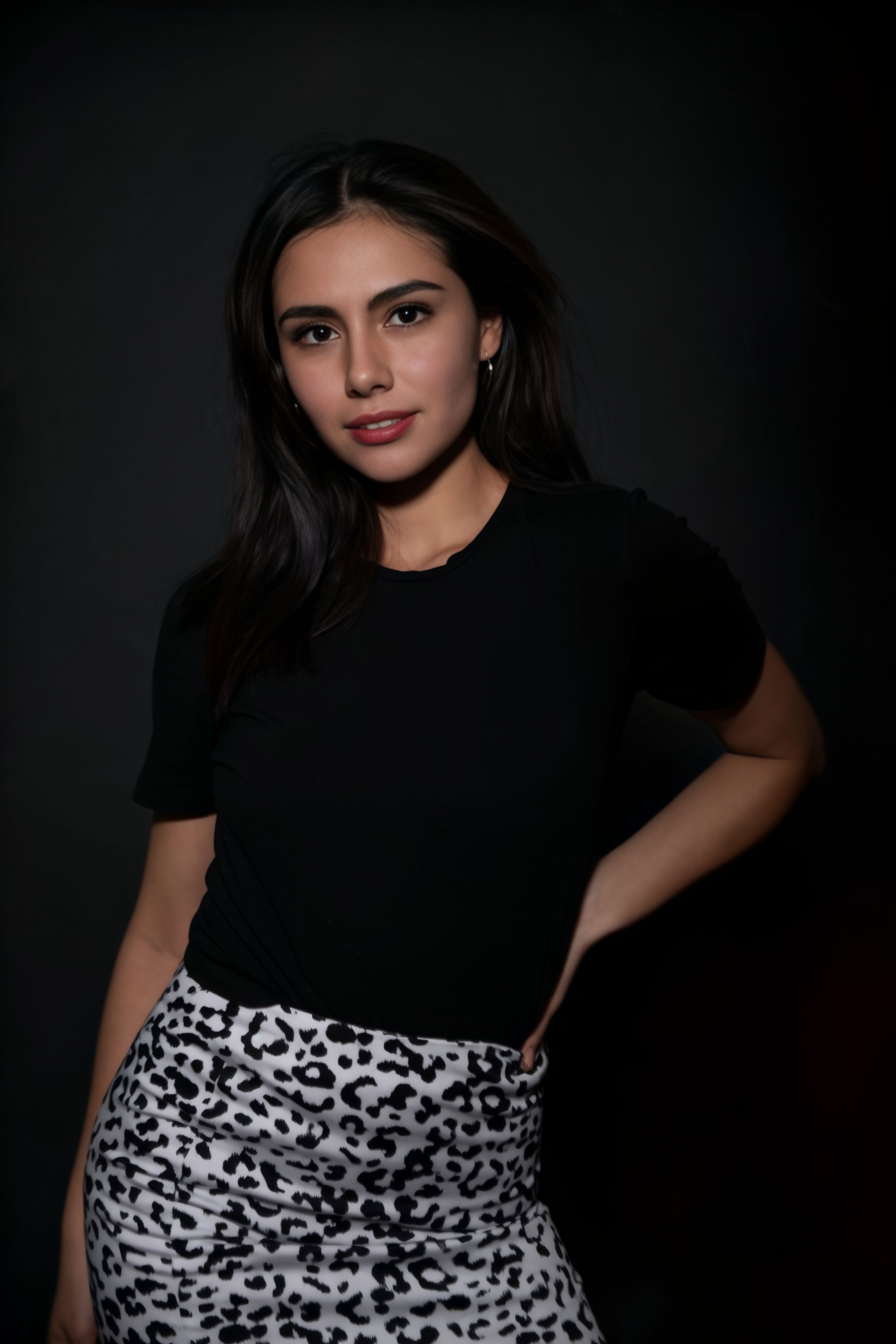 Elegant portrait of a woman in leopard print, exuding confidence and style.