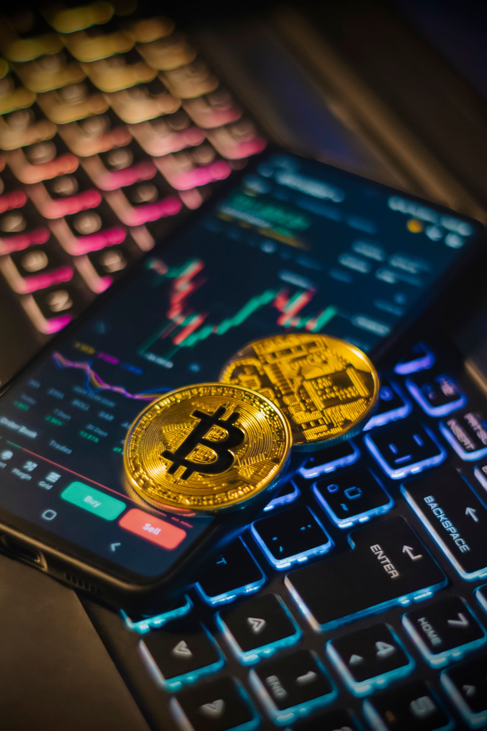 Bitcoin coins and a cryptocurrency trading screen during a strong quarterly market