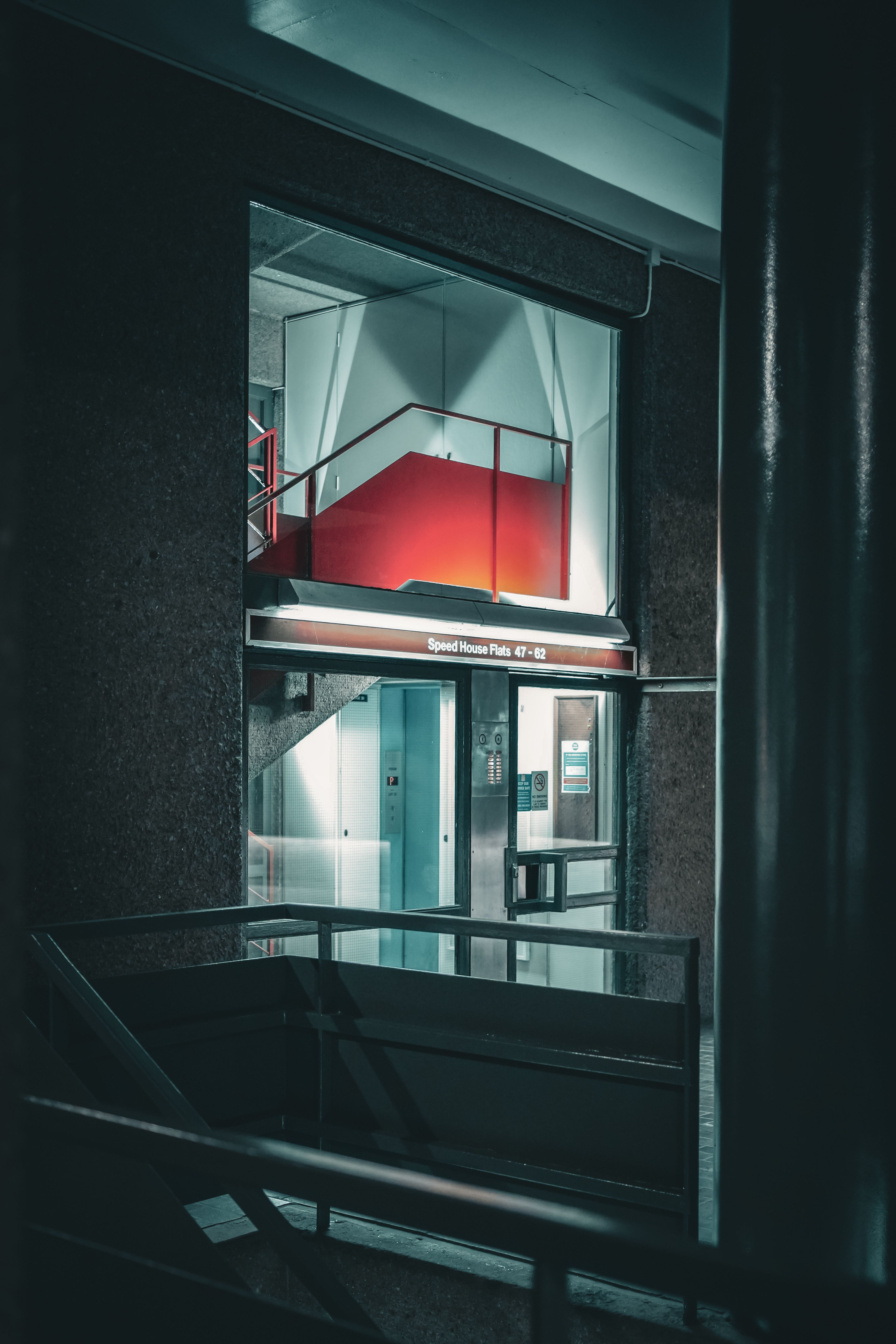 Night view of a modern urban elevator interior with dramatic lighting.