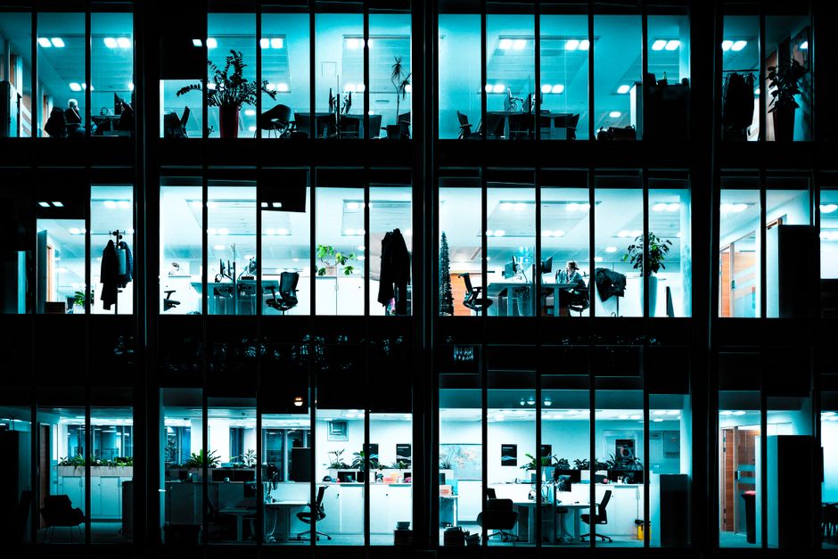A modern workspace with subtle astrological symbols, representing career success and financial abundance for the zodiac signs.