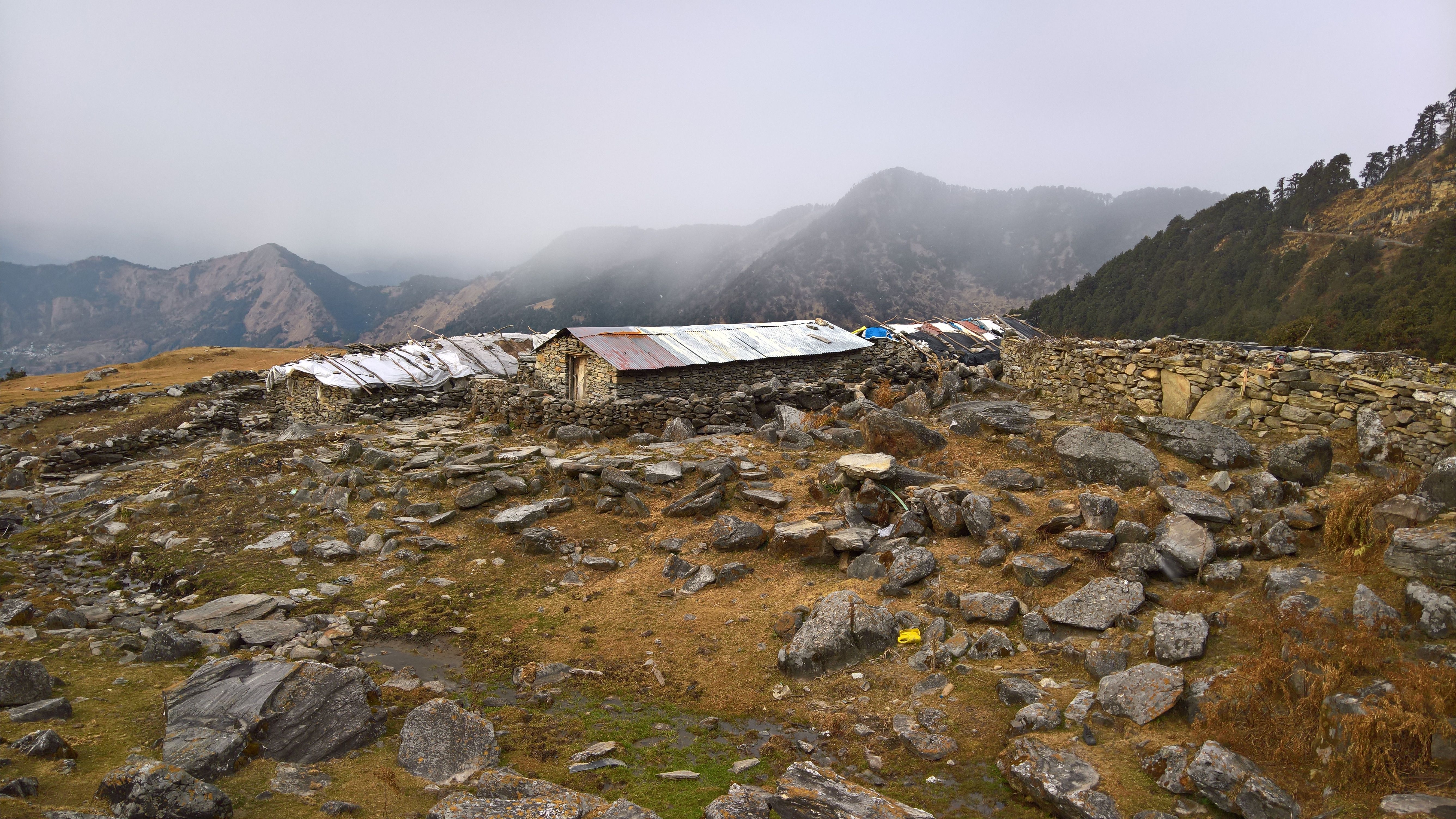A quiet mountain village with stone houses and blooming flowers - underrated vacation spots