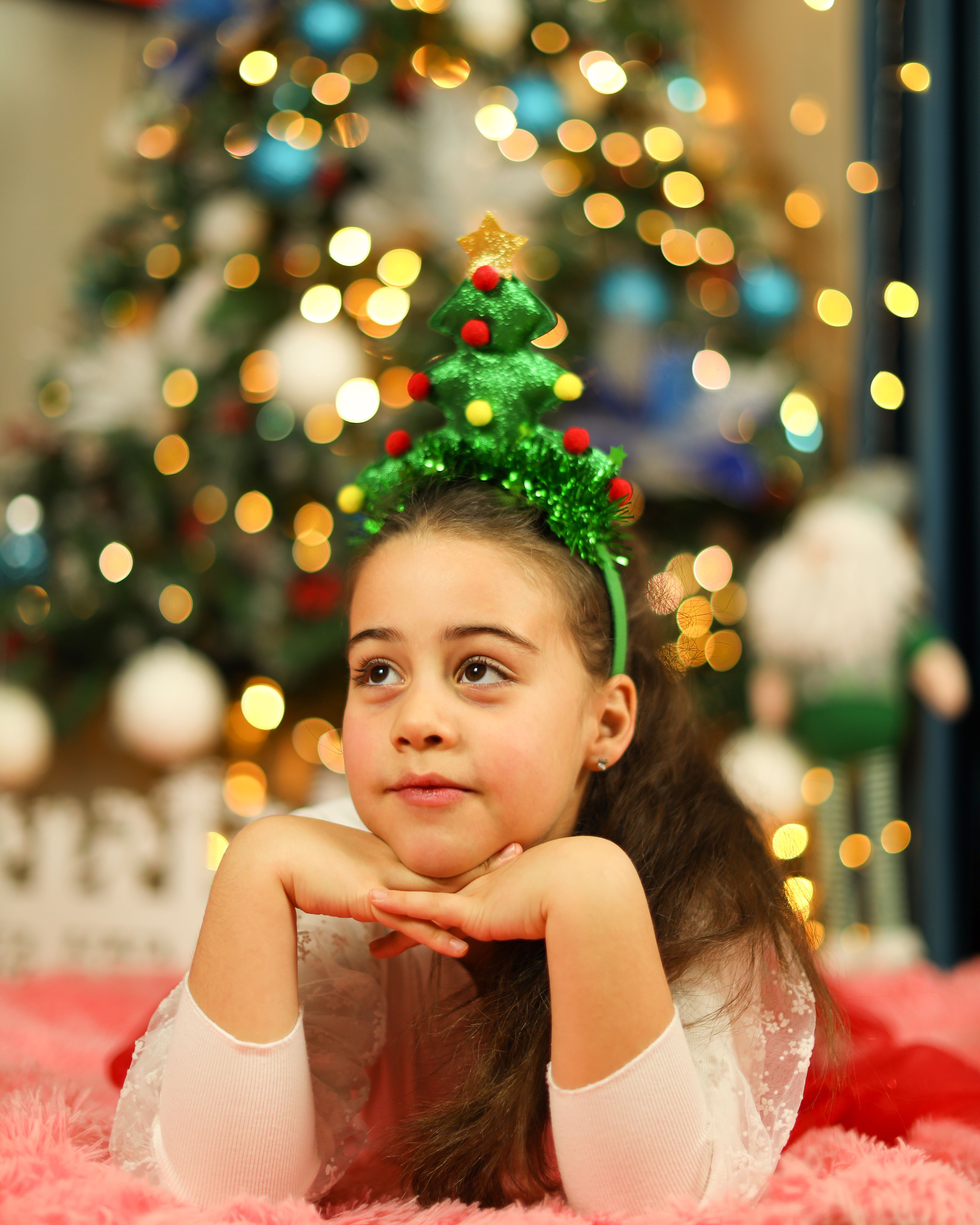 Festive Child with Christmas Tree Headband · Free Stock Photo