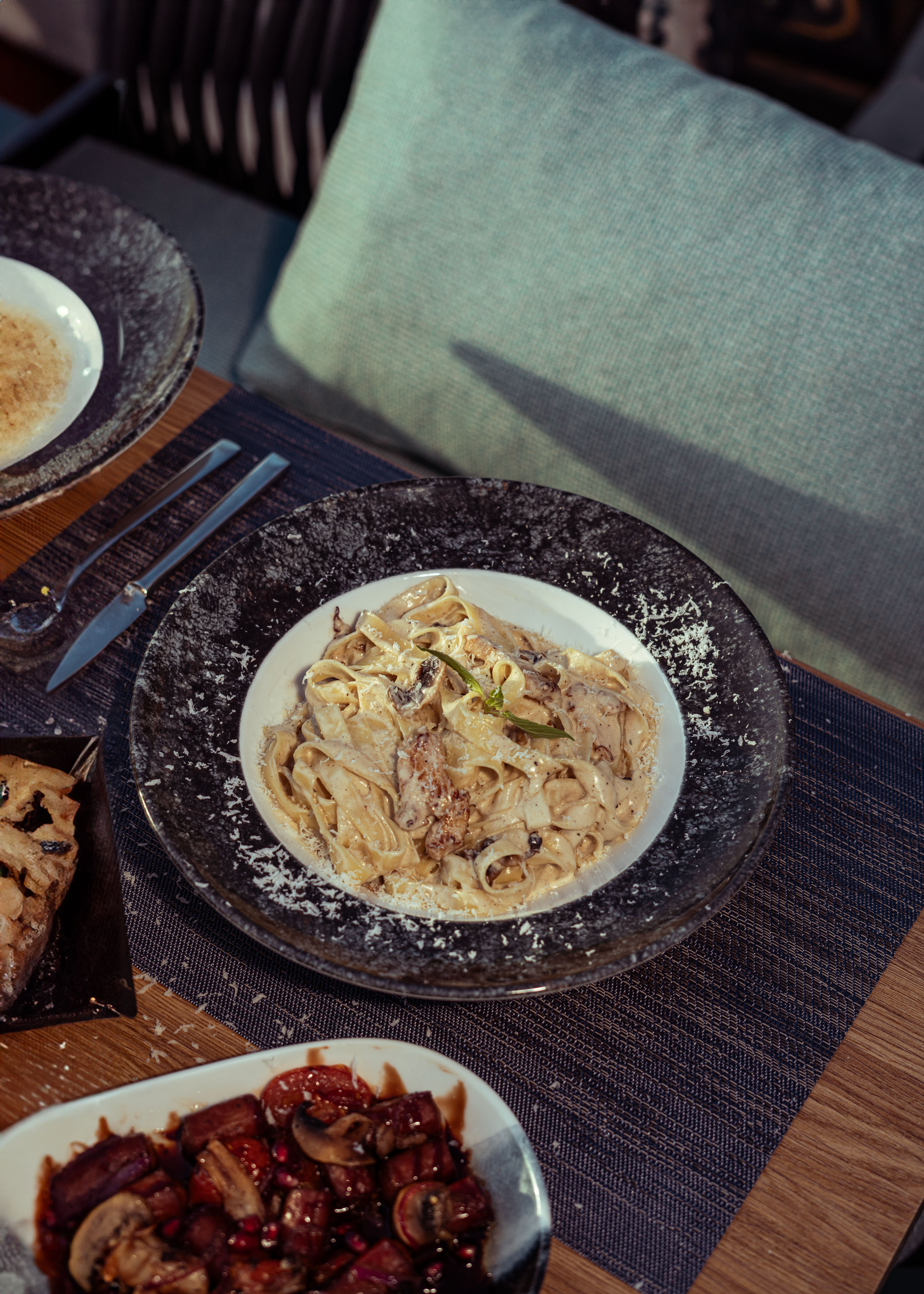 A mouth-watering plate of creamy pasta served at a restaurant in Baghdad, Iraq, perfect for food enthusiasts.