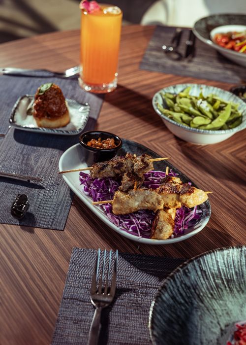 Free A variety of Middle Eastern dishes on a wooden table showcasing vibrant food plating. Stock Photo