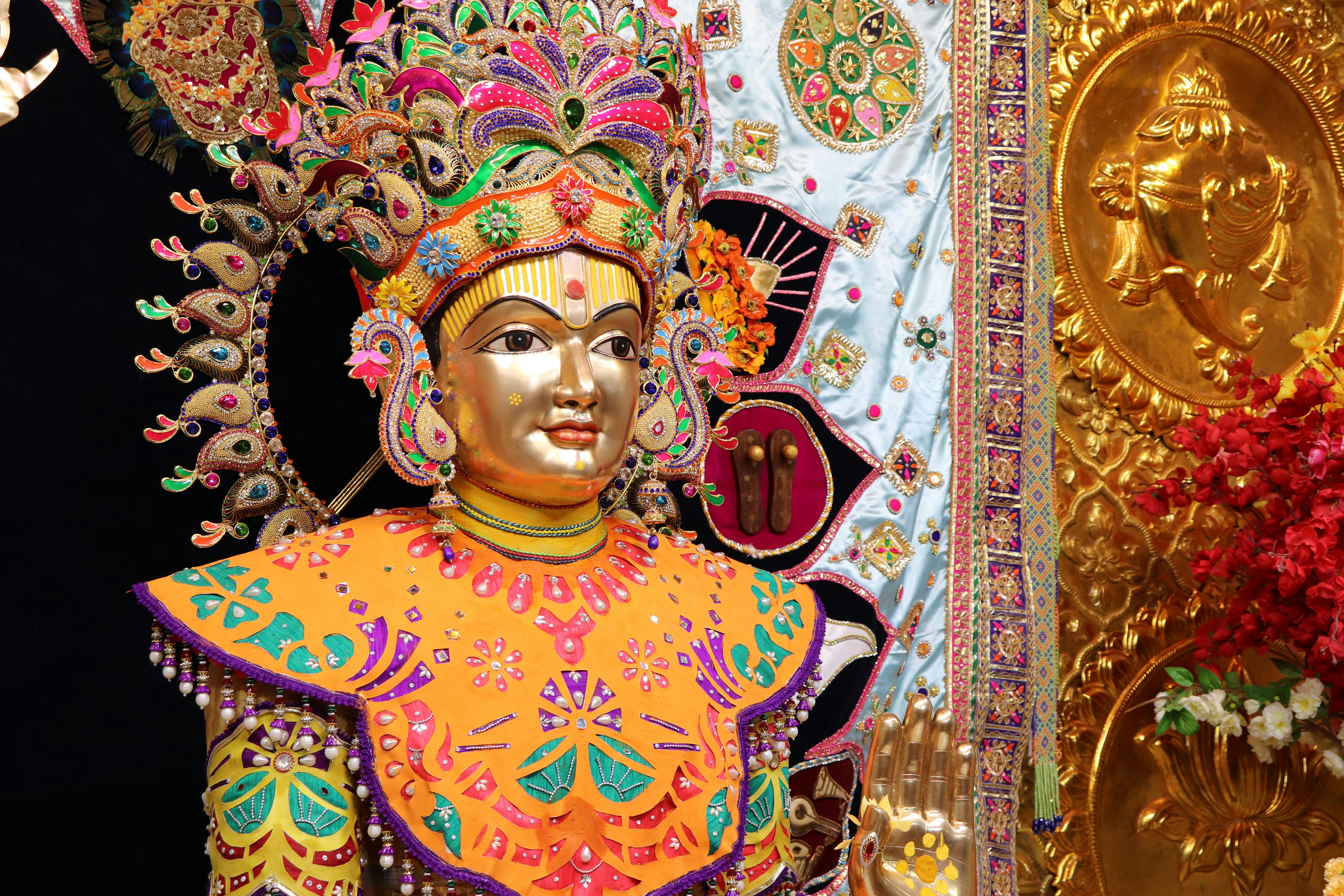 Colorful Indian deity statue in Poicha, Gujarat, featuring intricate craftsmanship and vibrant decoration.