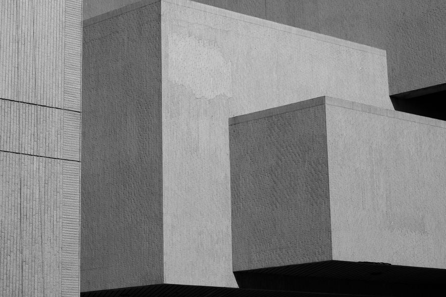 Black and white minimalist architectural facade with geometric form and clean lines