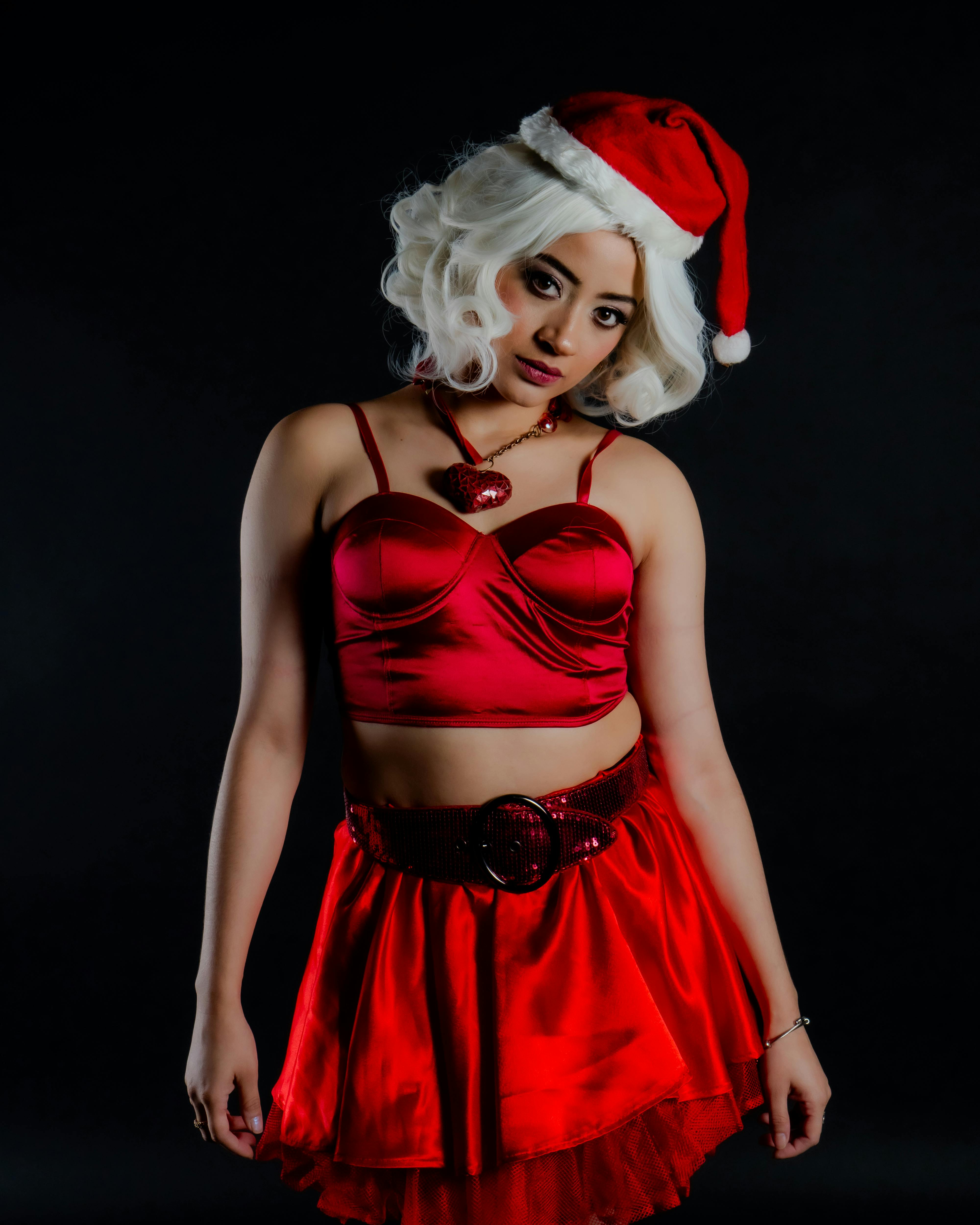 A festive portrait of a woman in a Santa outfit, perfect for holiday themes.