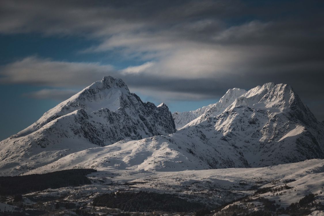 Majestic Snow-Covered Mountain Peaks at Twilight · Free Stock Photo