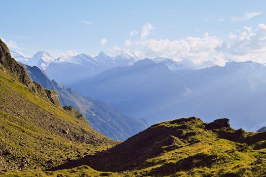 Beautiful view of the Alps with clear skies and snow-capped peaks.