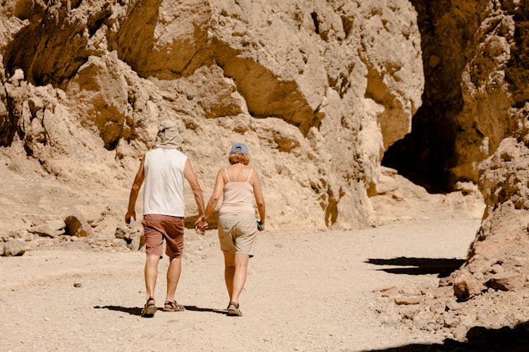 Couple Walking On Dirt Road