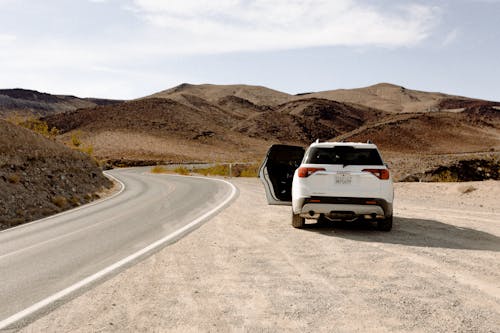 White Vehicle Parked Beside Road