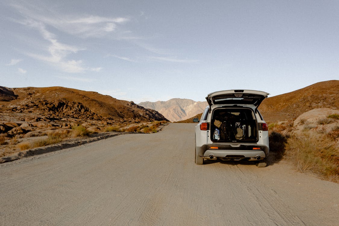 Photo of Vehicle Parked on Dirt Road