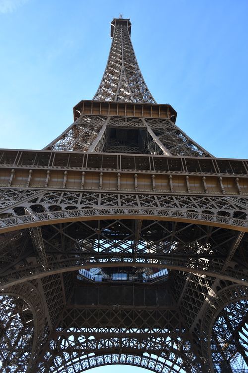 Free Stunning upward view of the iconic Eiffel Tower against a clear blue sky in Paris, France. Stock Photo