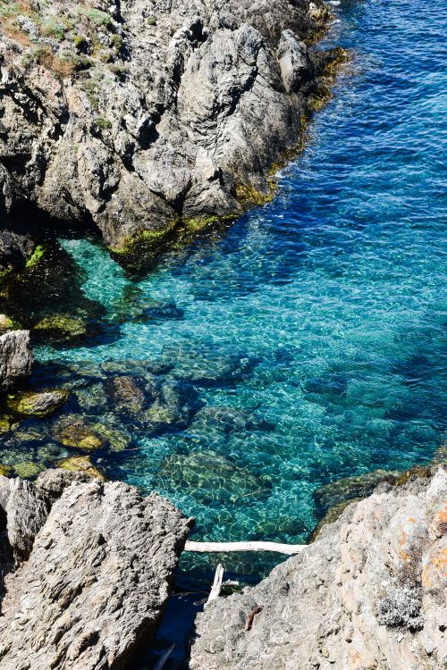 Free Explore the stunning rocky coastline and azure waters in Hyères, Provence-Alpes-Côte d'Azur. Stock Photo
