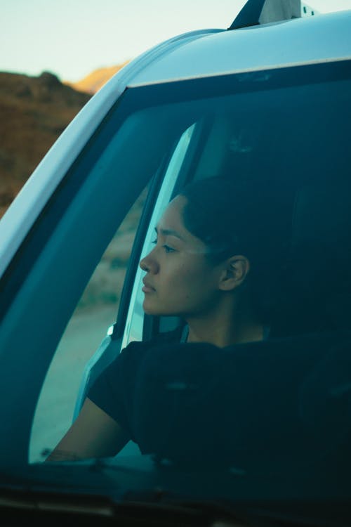 Woman Sitting Inside the Vehicle