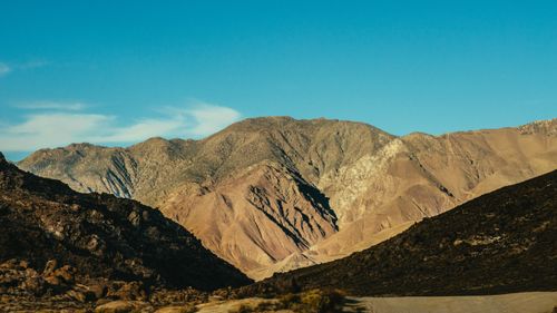 Free Captivating view of rugged mountains against a clear blue sky, showcasing natural beauty and tranquility. Stock Photo