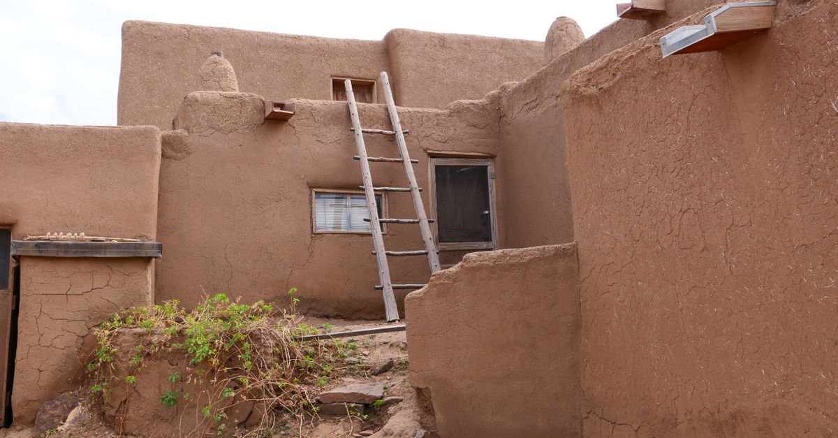 Traditional adobe architecture in Taos Pueblo, New Mexico showcasing rustic charm.