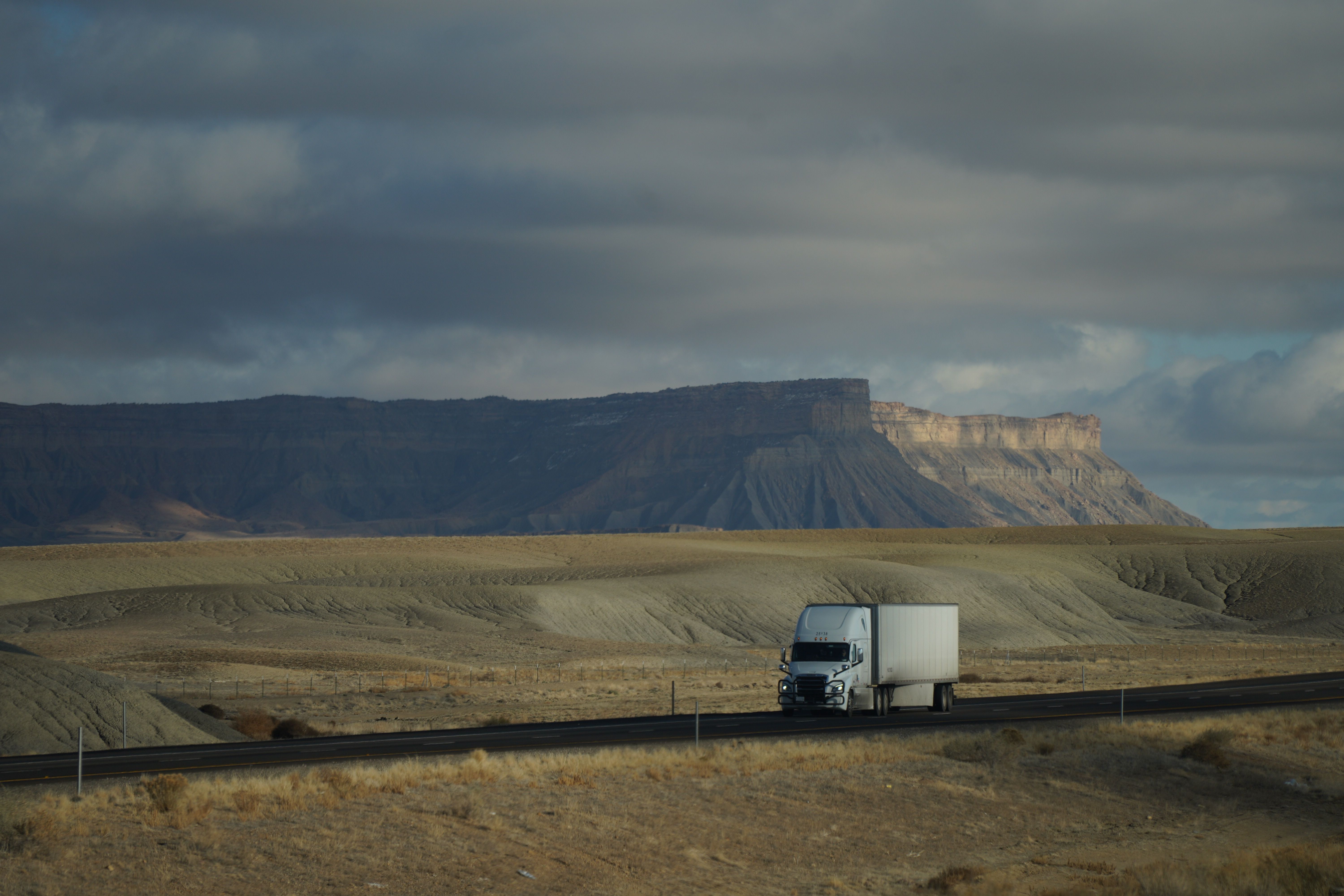 Trucking Through Dramatic Desert Landscape · Free Stock Photo