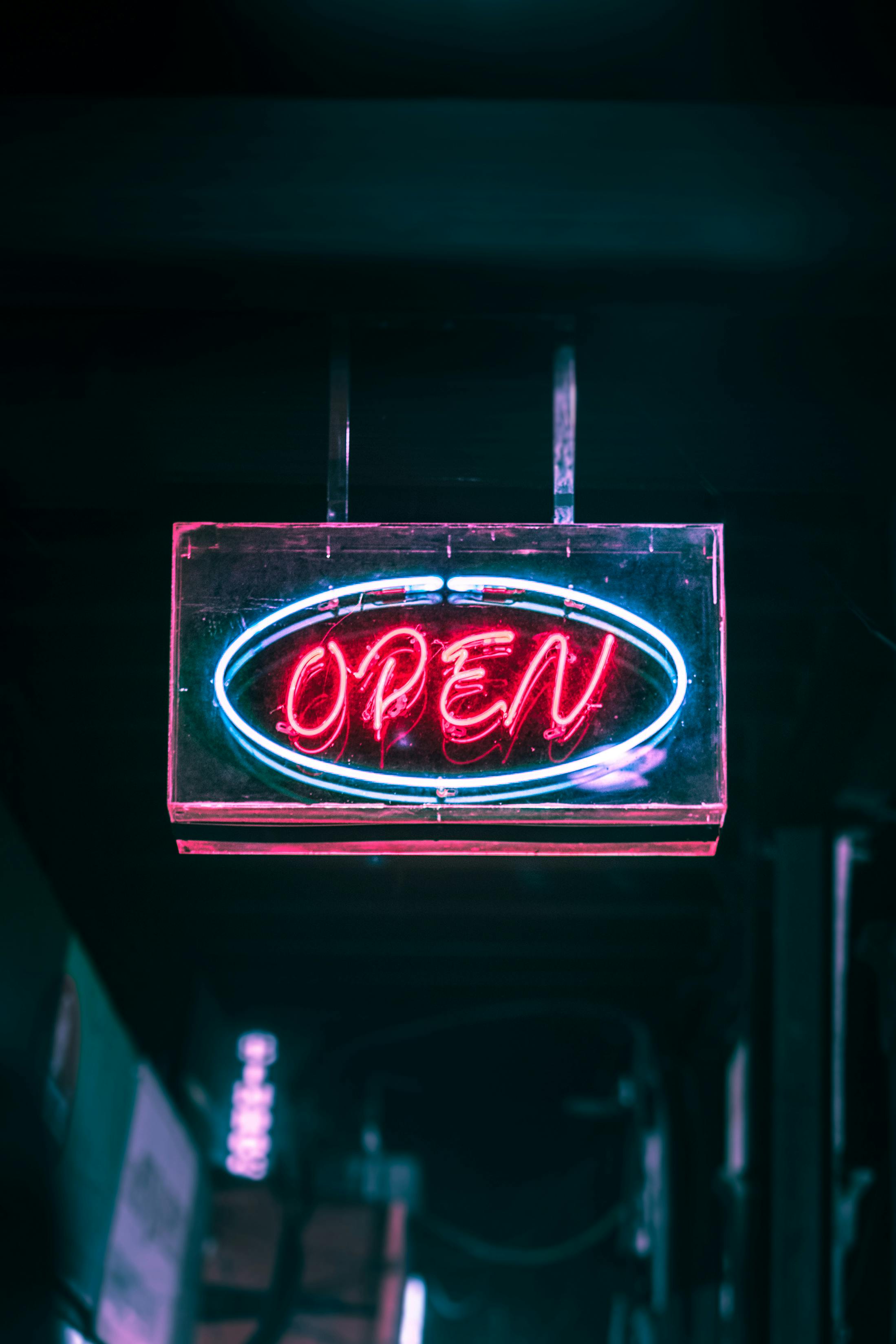 Image Name “open” neon signage turn on outside a storefront