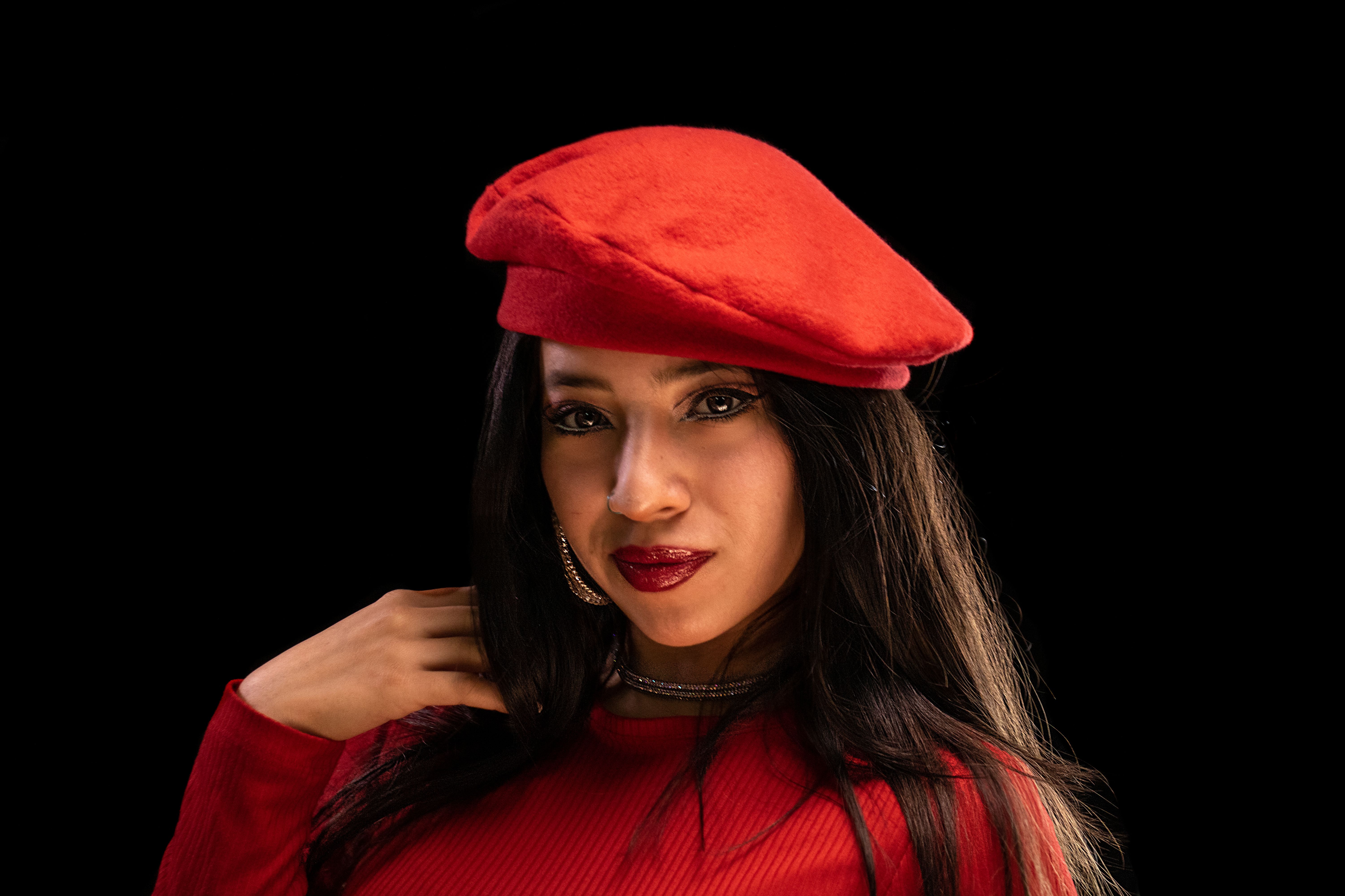 Elegant Woman in Red Beret on Black Background · Free Stock Photo