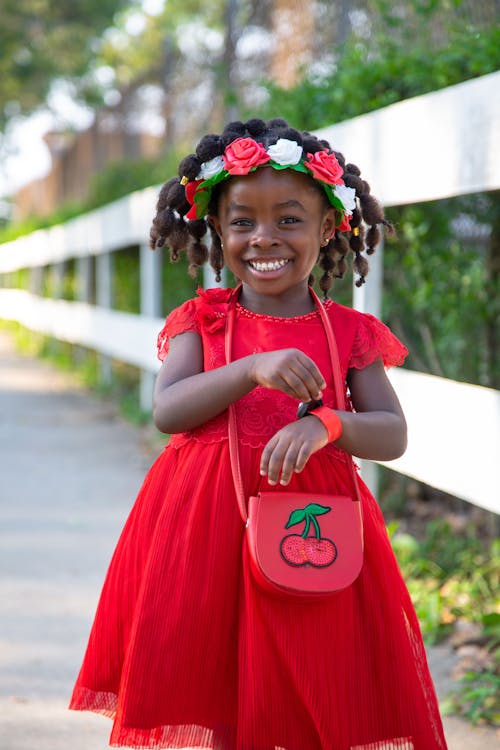 Smiling Girl with banding protective hairstye