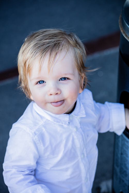 Free Photo Of Toddler Sticking His Tongue Out Stock Photo