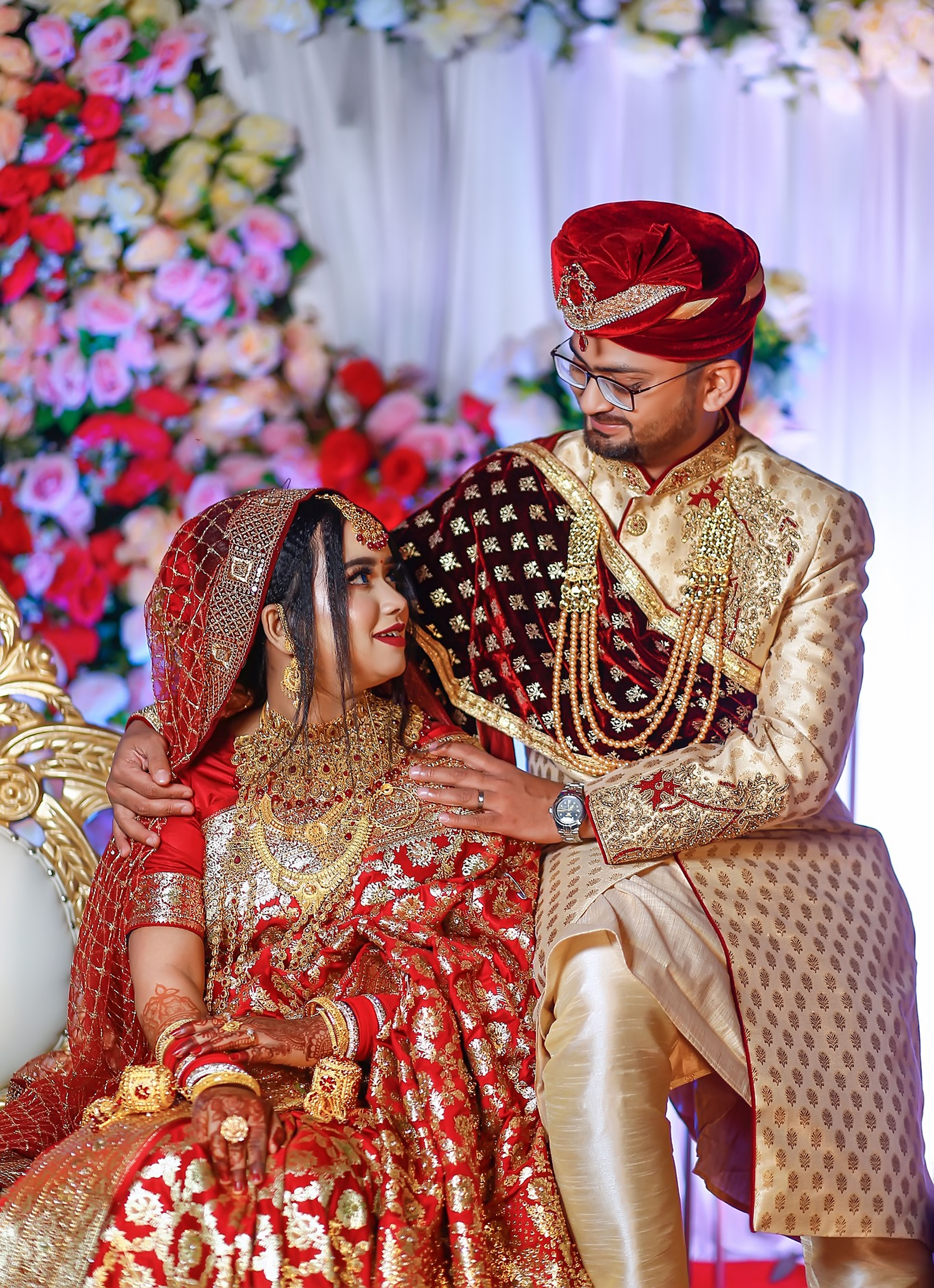 Colorful Indian wedding ceremony with bride and groom in traditional attire in Dubai.