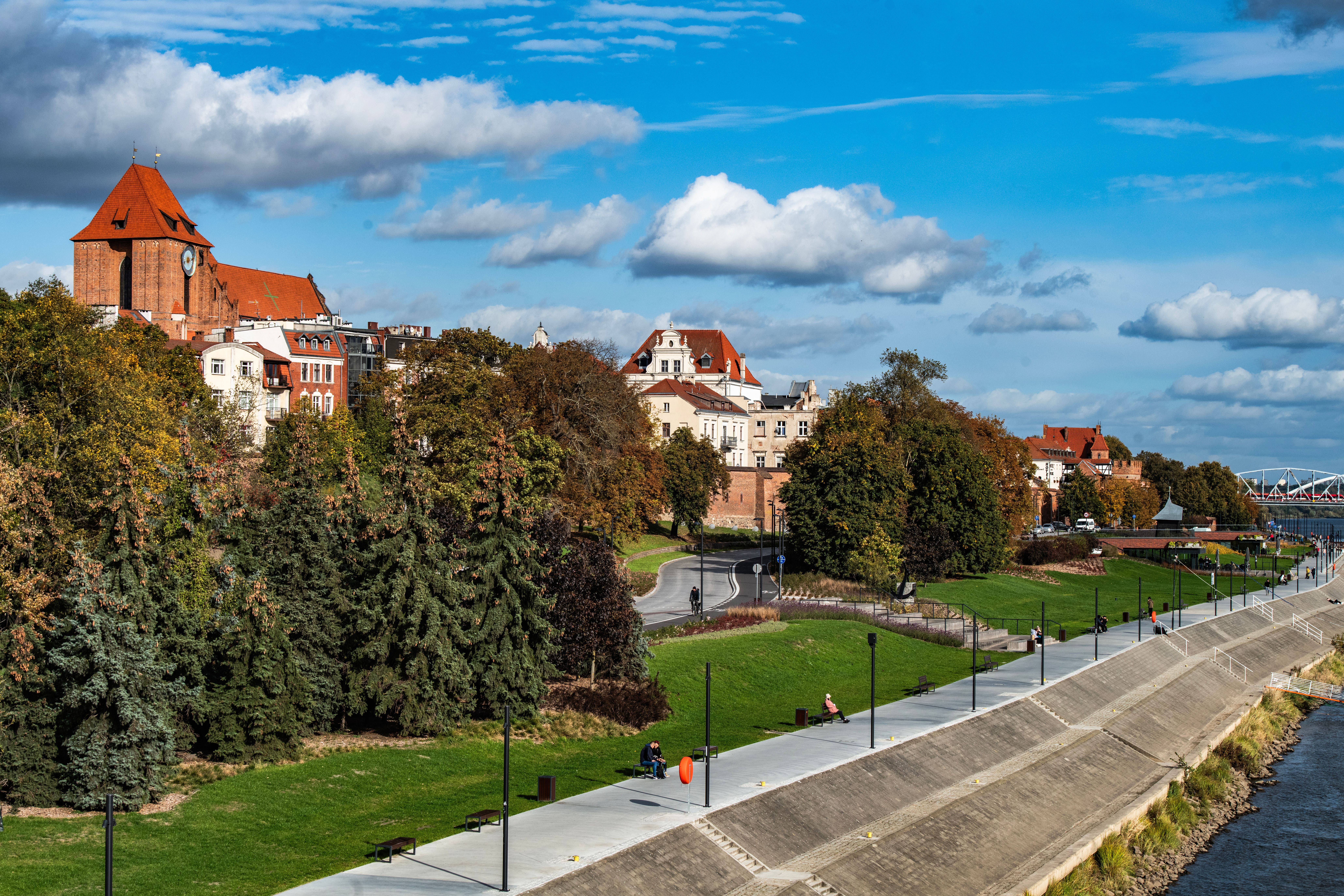 Scenic Riverside View with Historic Architecture · Free Stock Photo