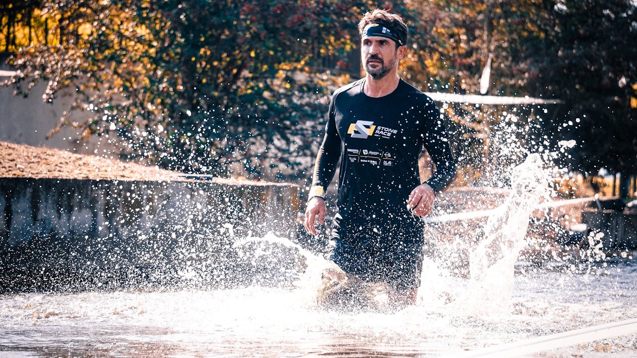 Free Man Running on Water Stock Photo