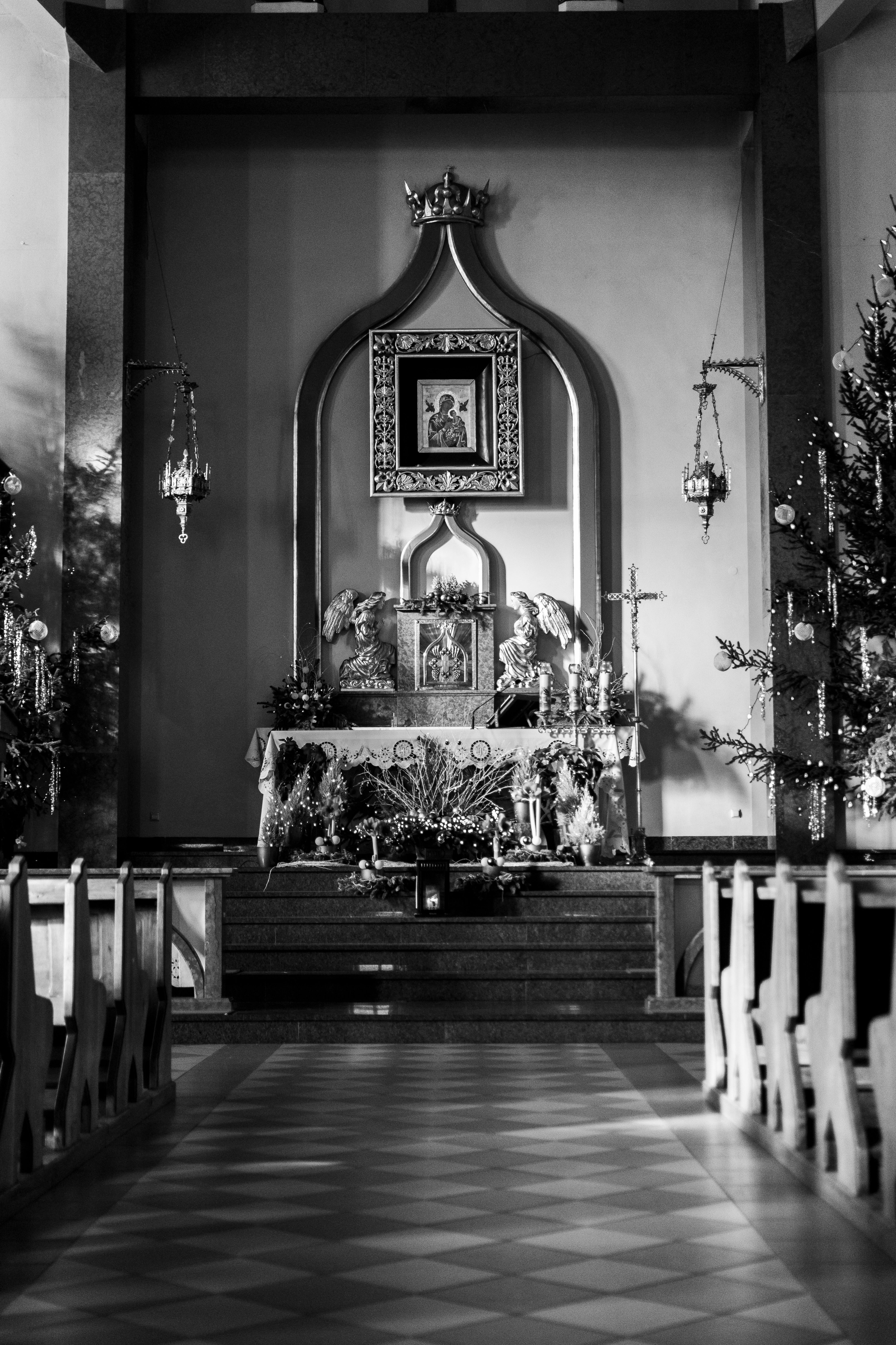 Festively decorated church interior in Wrocław, showcasing Christmas décor and historic architectural charm.