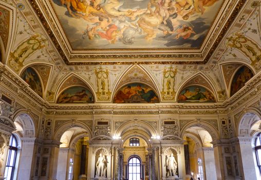 Intricately decorated museum interior showcasing a grand frescoed ceiling and elegant architecture.