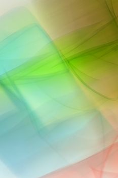 Vibrant abstract light patterns with hues of green, blue, and red creating a dynamic visual.