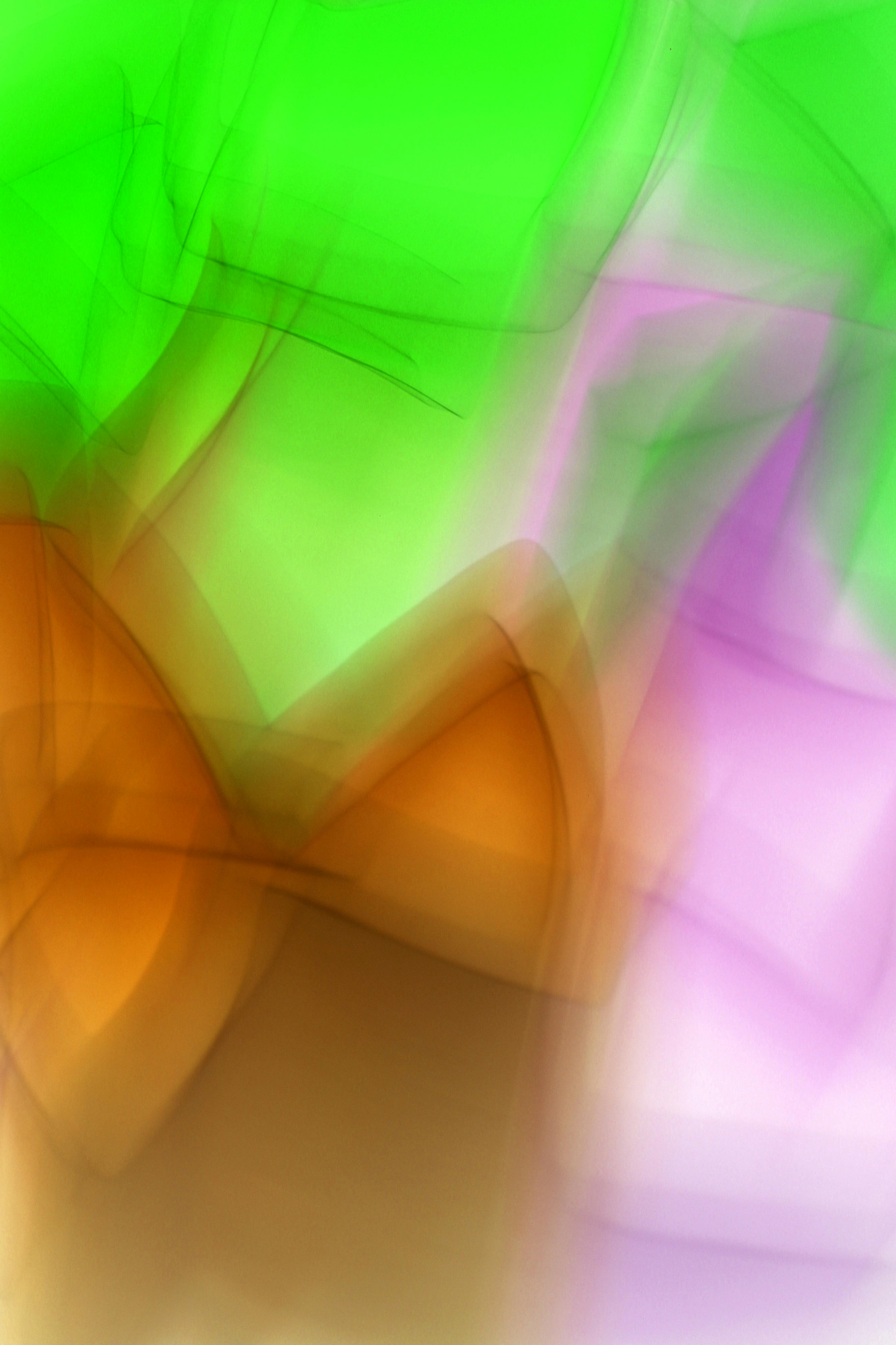 Free A vibrant abstract art piece showcasing dynamic colors in green, purple, and orange. Stock Photo