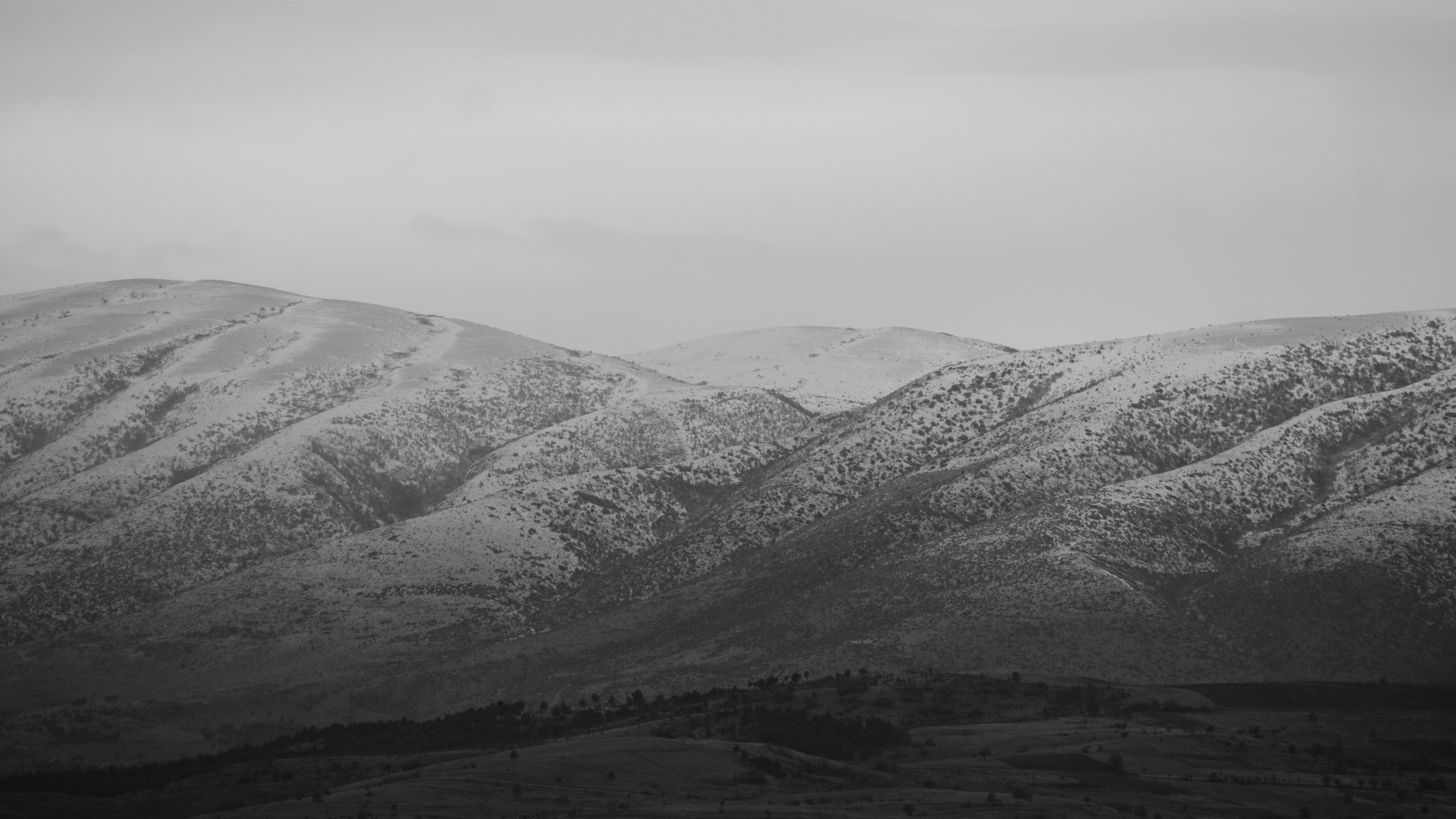 Black and white photo of snow-covered mountains in Üsküp, Macedonia.