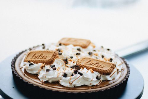 Free Luxurious Lotus Biscoff tart topped with whipped cream and chocolate chips. Stock Photo