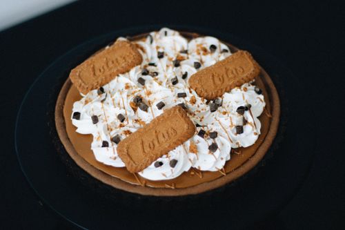 Free A delectable Speculoos cookie cream pie with whipped topping, perfect for dessert lovers. Stock Photo