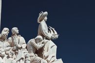 Monument to the Discoveries in Lisbon, Portugal, showcasing historic explorers under a vibrant blue sky.