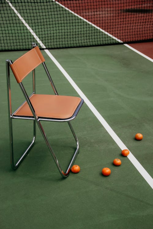 Chair on Tennis Court during Day