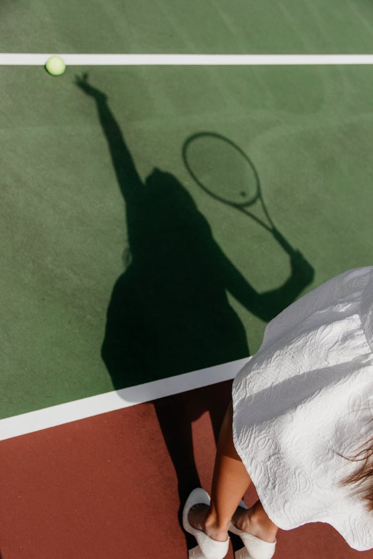 Shadow Of Woman Playing Tennis