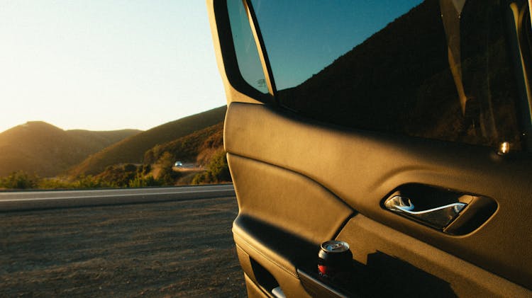 Car With Opened Door Near Road