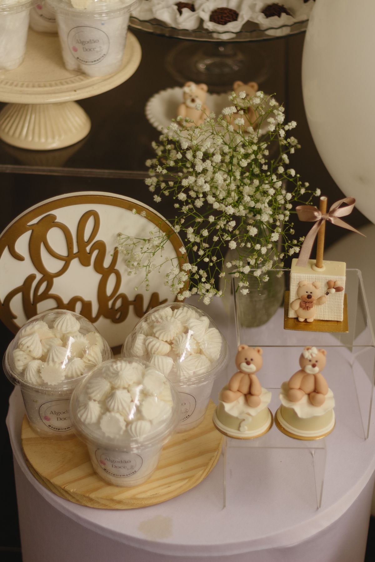 Teddy bears sweets and flowers on a dessert table