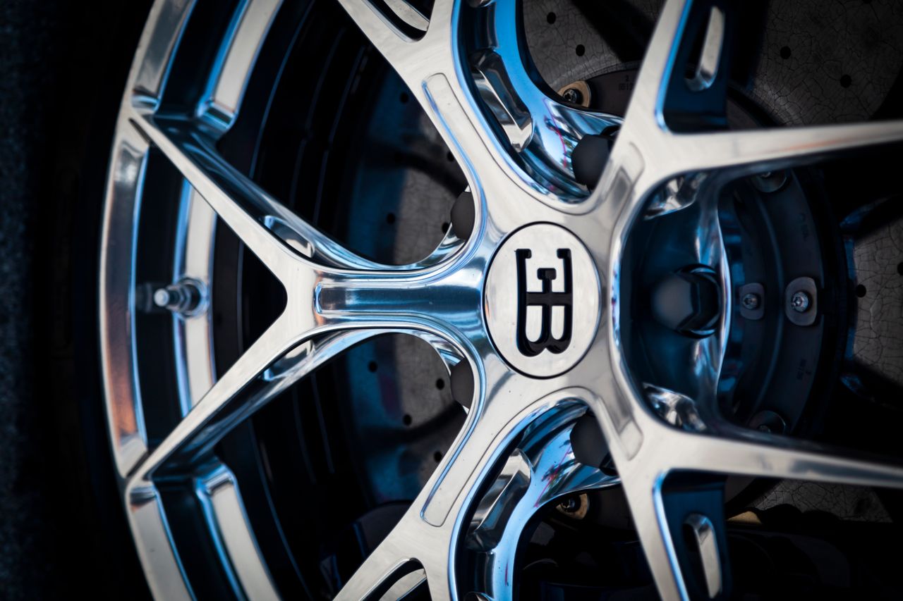 high quality close up shot of a luxury car wheel rim showcasing elegan