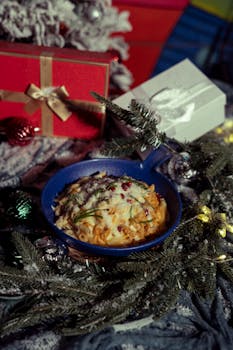 A delicious baked dish in a festive setting with Christmas decorations and gifts.