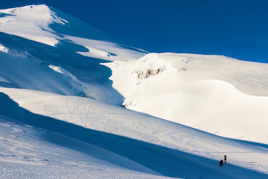 Breathtaking view of snow-covered Volcán Villarrica in Pucón, Chile under a clear blue sky.