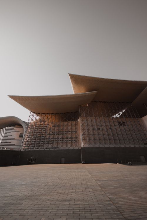 Free Contemporary architecture with unique roof structure in Huaian, China, under clear sky. Stock Photo