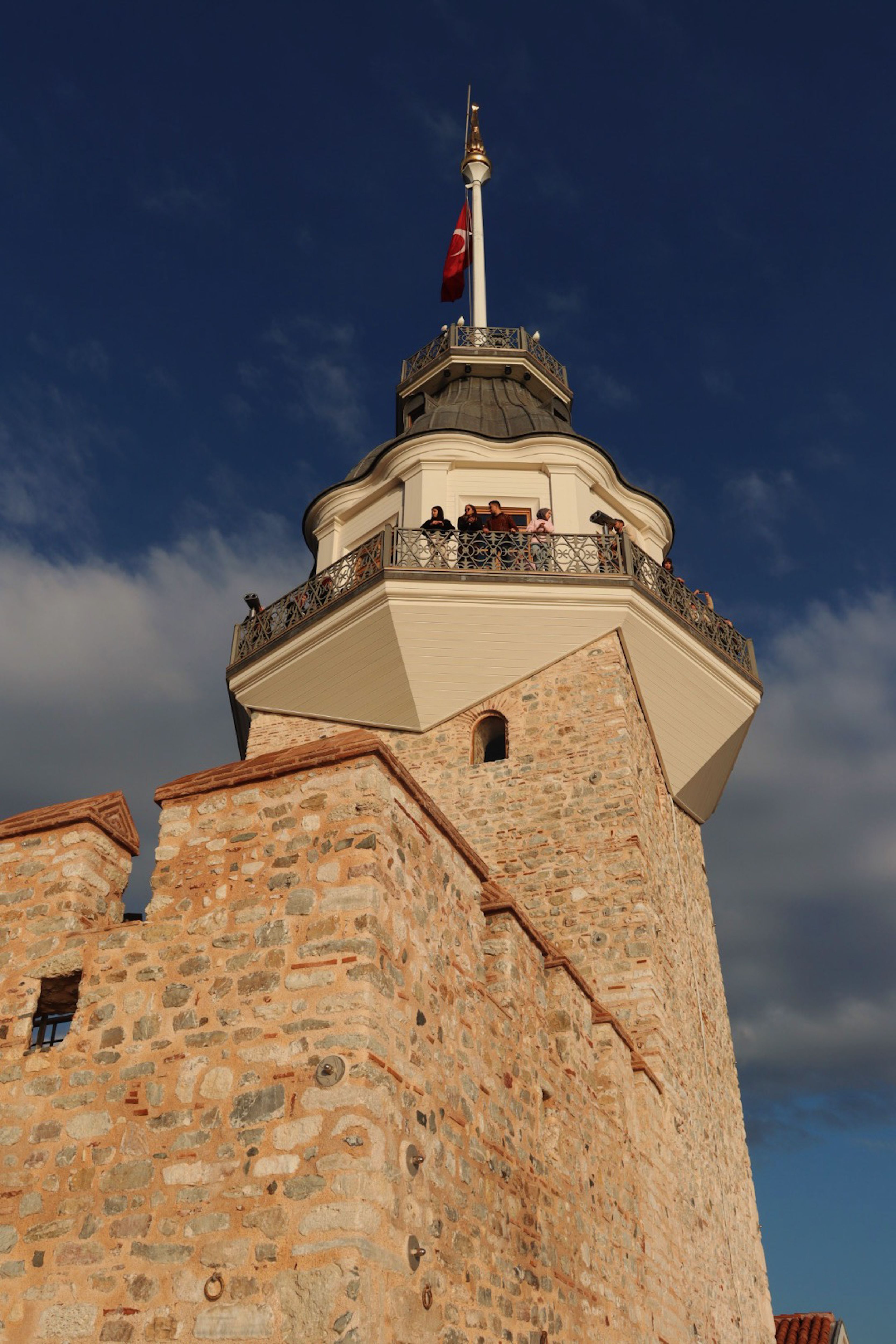 Historic Stone Lighthouse Tower Against Blue Sky · Free Stock Photo