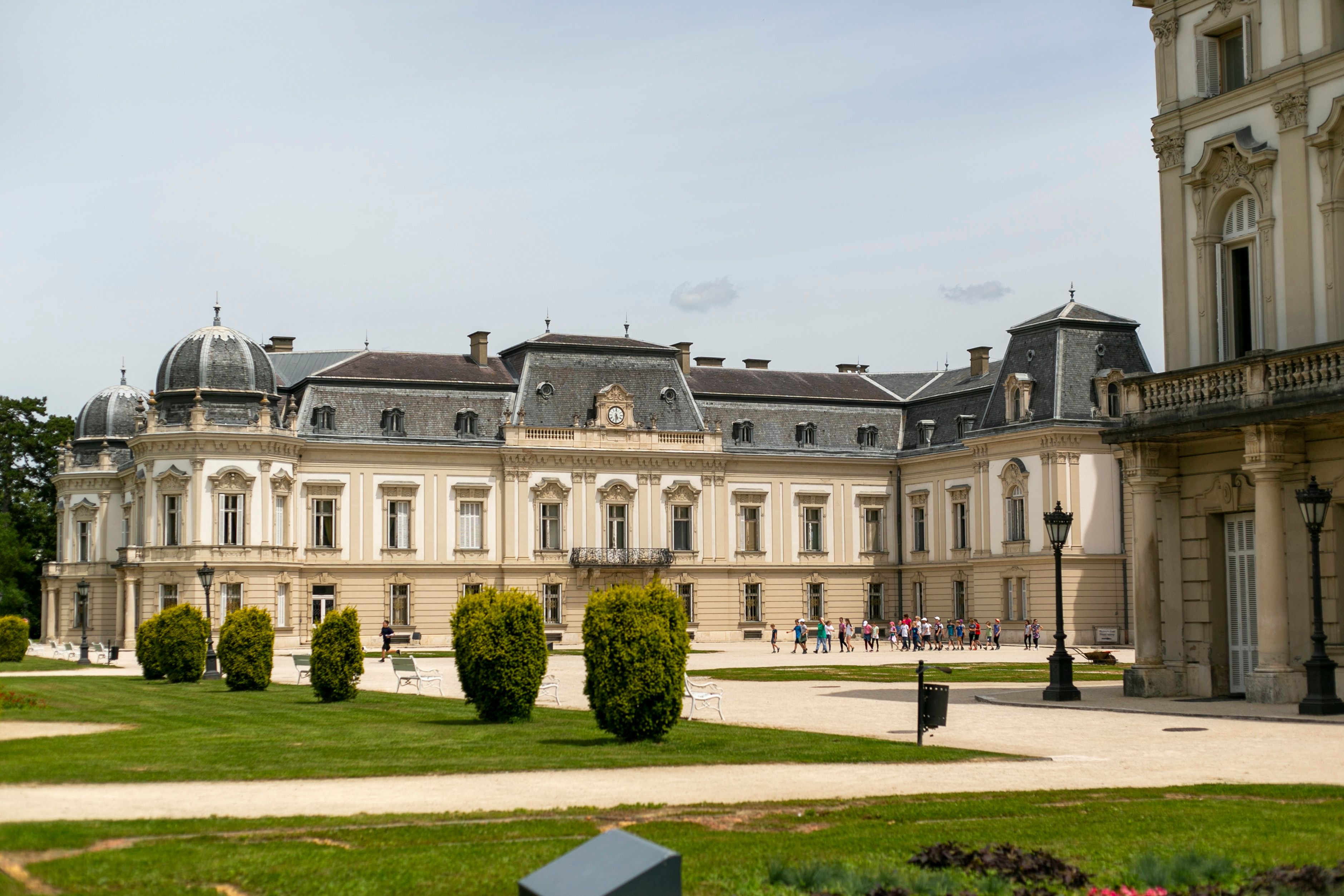 Exterior view of the historical Festetics Palace in Keszthely, Hungary, showcasing its Baroque architecture.
